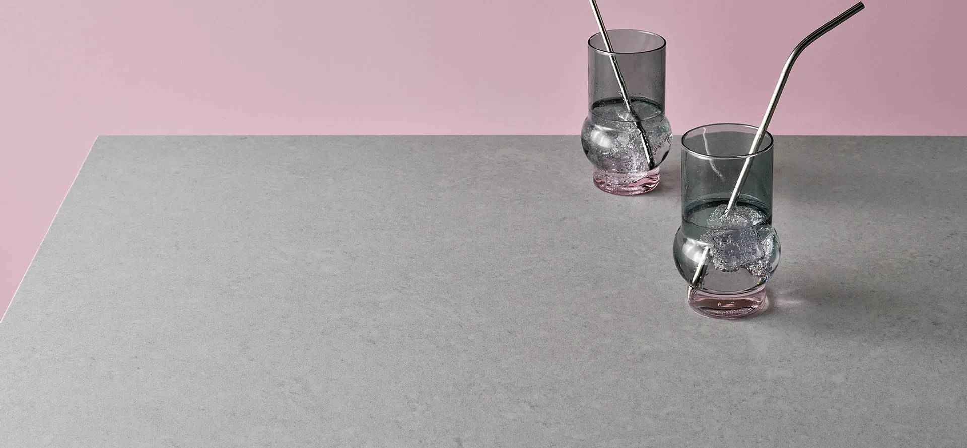 Caesarstone 4643 flannel grey surface with two glasses